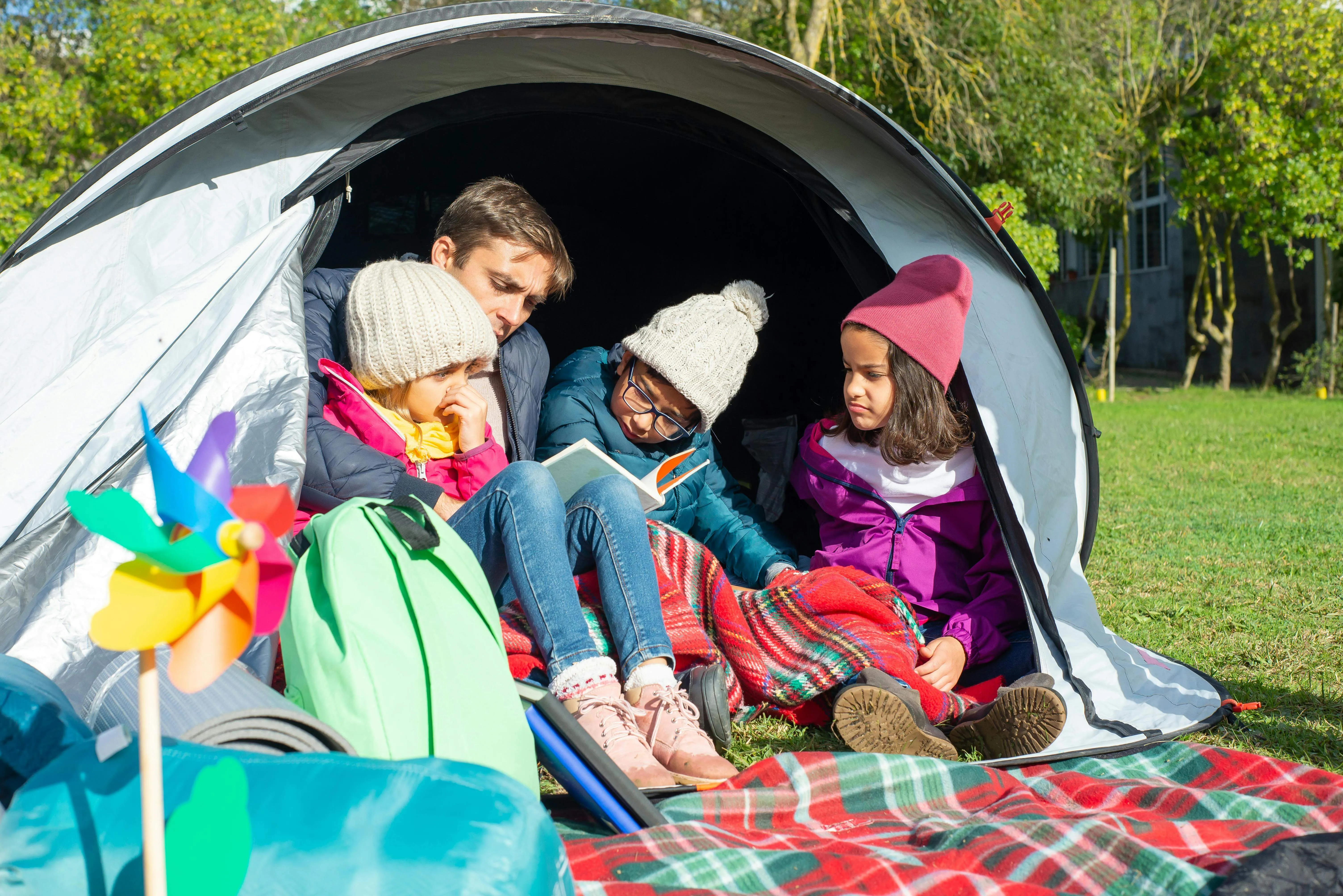 A large family tent at a campsite.